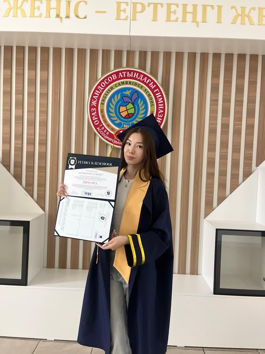 Salima Dauletkerey with her diploma